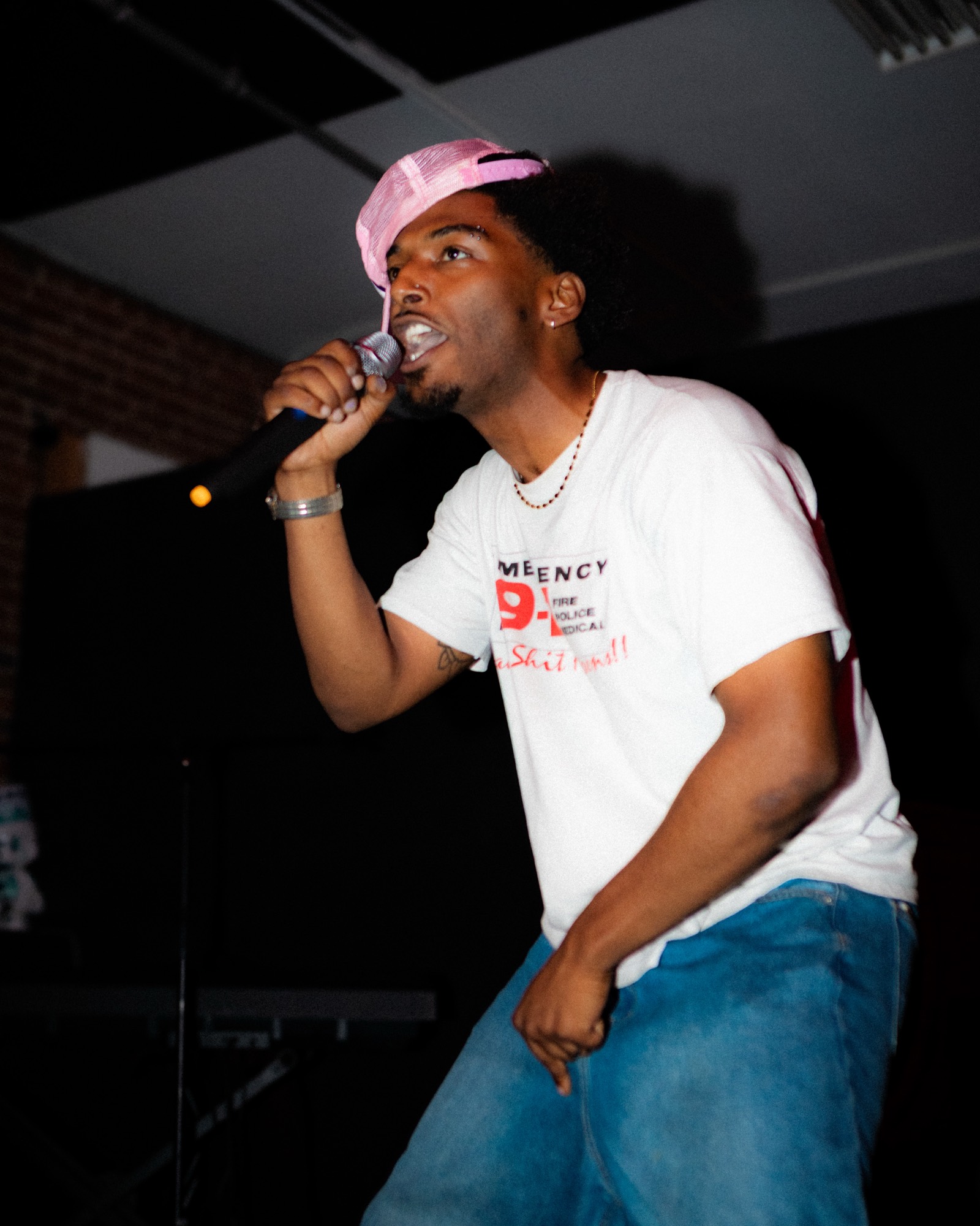Rapper performing with the mic